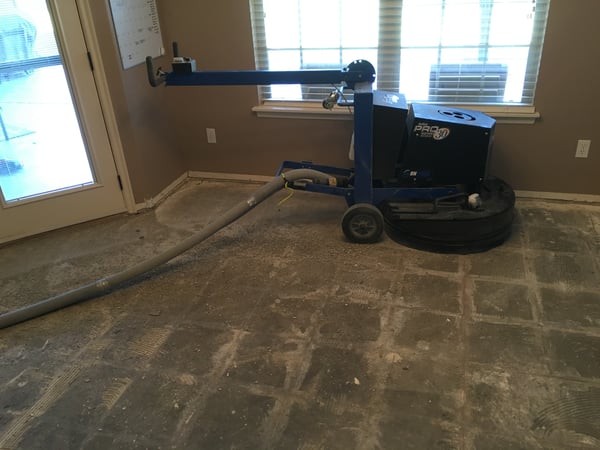 USE A FLOOR GRINDER FOR EFFICIENT REMOVAL