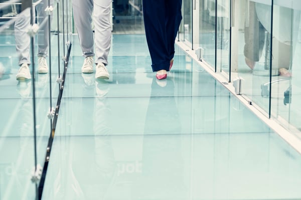 businesswomen-walking-along-corridor-of-office-2024-06-25-17-51-33-utc