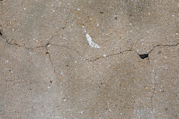 cracks-cement-surface-with-stain