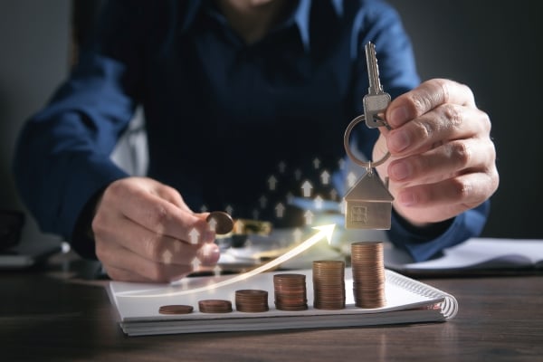 showing-house-key-stack-coins-real-estate-graph-house-market-growth