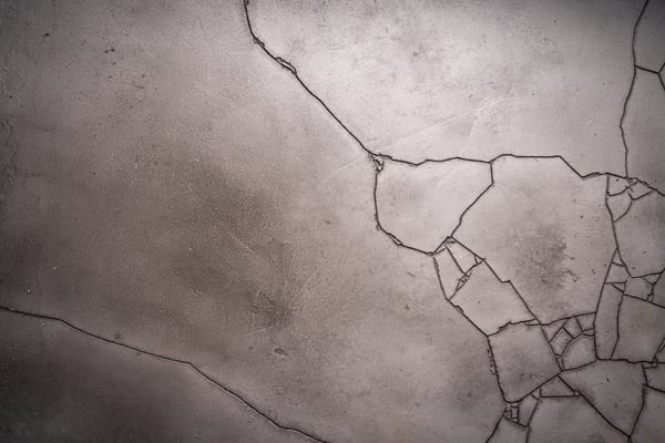 common causes of damaged concrete 
